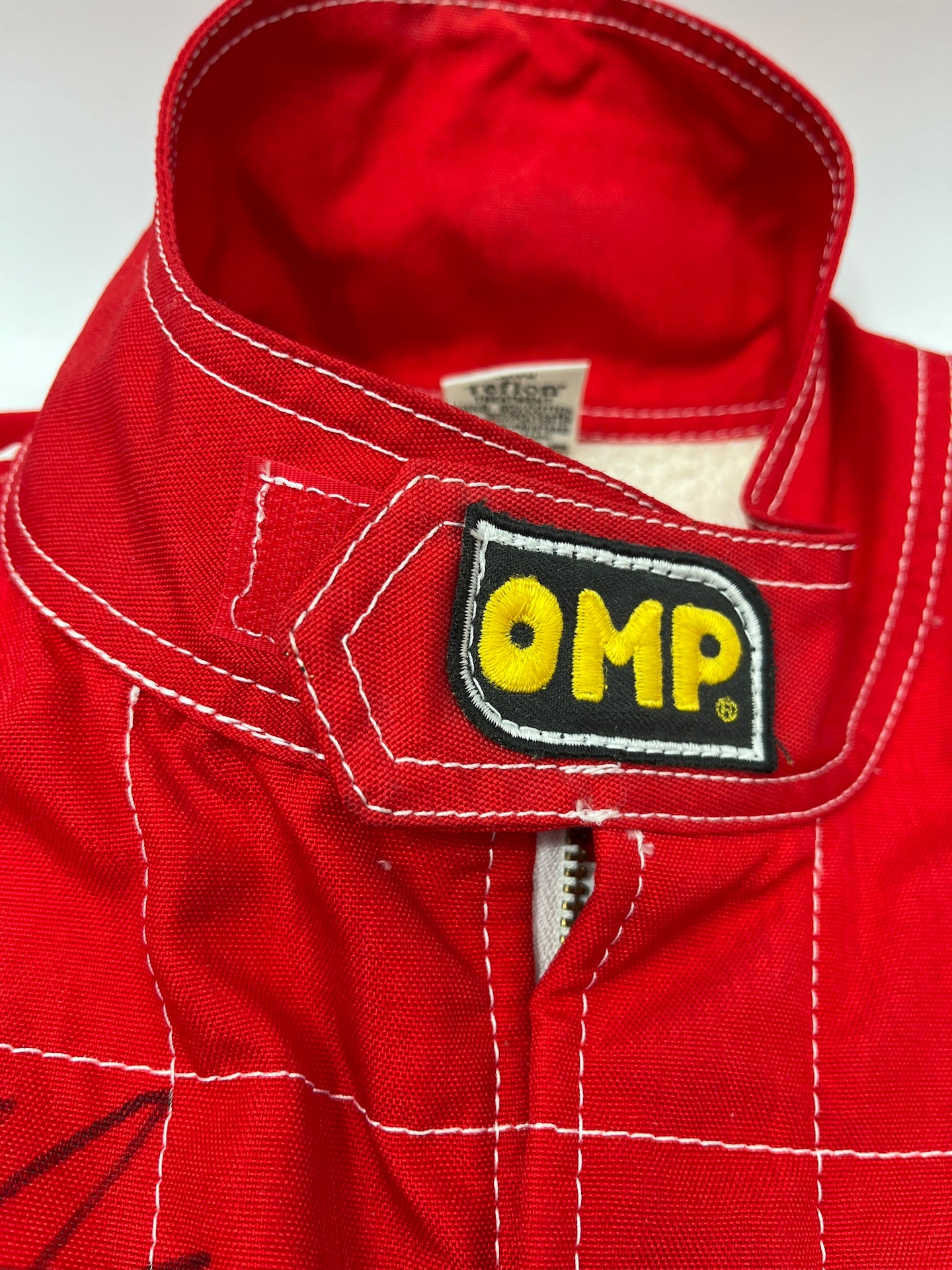 OMP Rennanzug signiert von Michael Schumacher Autogramm