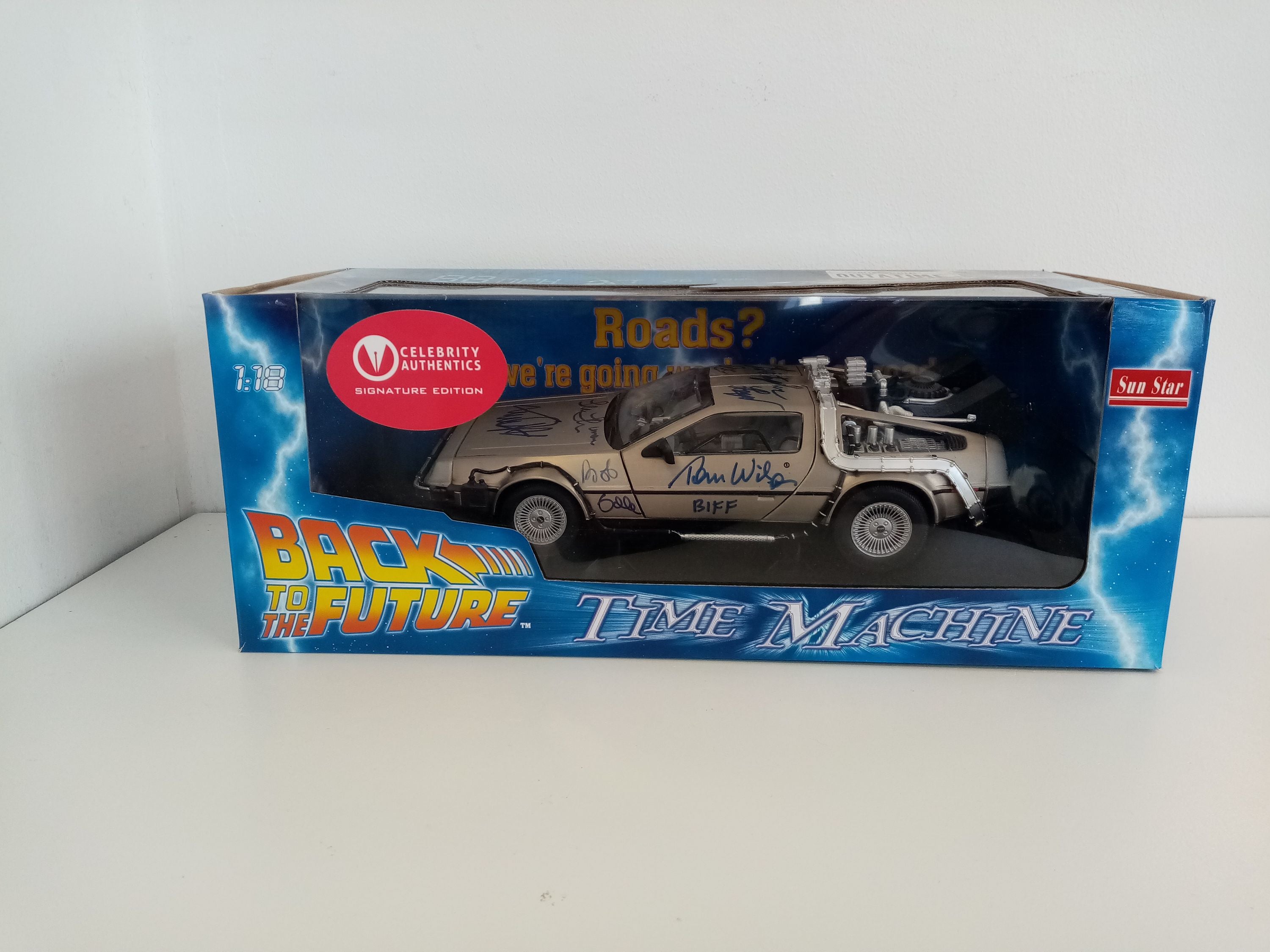 Back to the future model car signed by the actors of the film