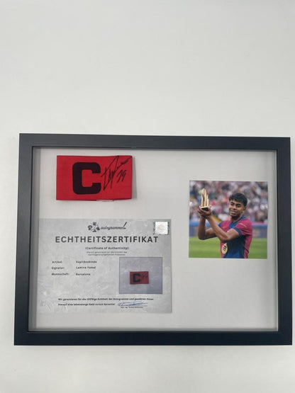 Captain's armband signed by Lamine Yamal in a framed FC Barcelona COA autograph