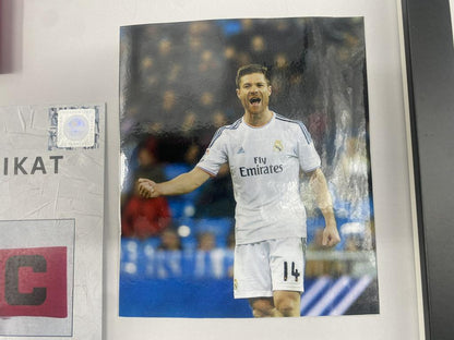 Captain's armband signed by Xabi Alonso in a Real Madrid football COA autograph frame