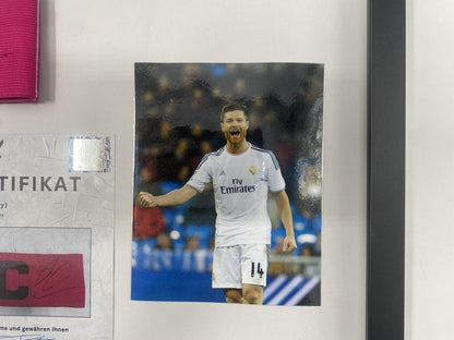 Captain's armband signed by Xabi Alonso in a Real Madrid football COA autograph frame