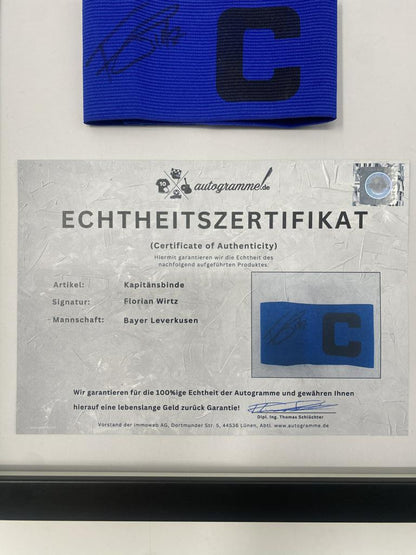Captain's armband signed by Florian Wirtz in a Bayer Leverkusen autograph frame