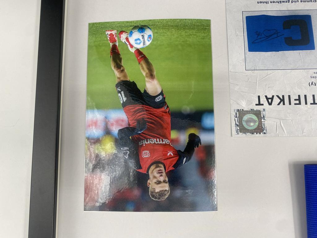 Captain's armband signed by Florian Wirtz in a Bayer Leverkusen autograph frame