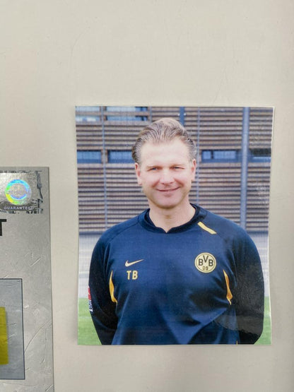 Captain's armband signed by Wolfgang "Teddy" de Beer in a Borussia Dortmund COA frame