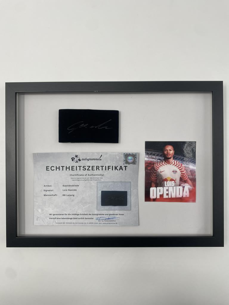 Captain's armband signed by Lois Openda in a framed RB Leipzig autograph
