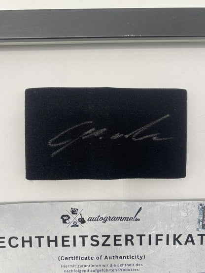 Captain's armband signed by Lois Openda in a framed RB Leipzig autograph