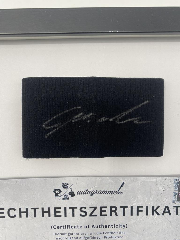 Captain's armband signed by Lois Openda in a framed RB Leipzig autograph