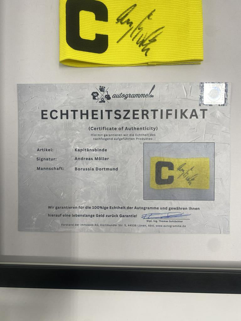 Captain's armband signed by Andreas Möller in a BVB autograph COA frame
