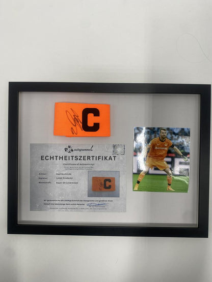 Captain's armband signed by Lukáš Hrádecký in a frame, Bayer 04 Leverkusen autograph