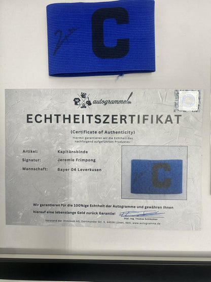 Captain's armband signed by Jeremie Frimpong in a frame, Bayer 04 Leverkusen autograph