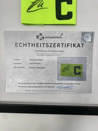 Captain's armband signed by Xabi Alonso in a Bayern Munich autograph COA frame