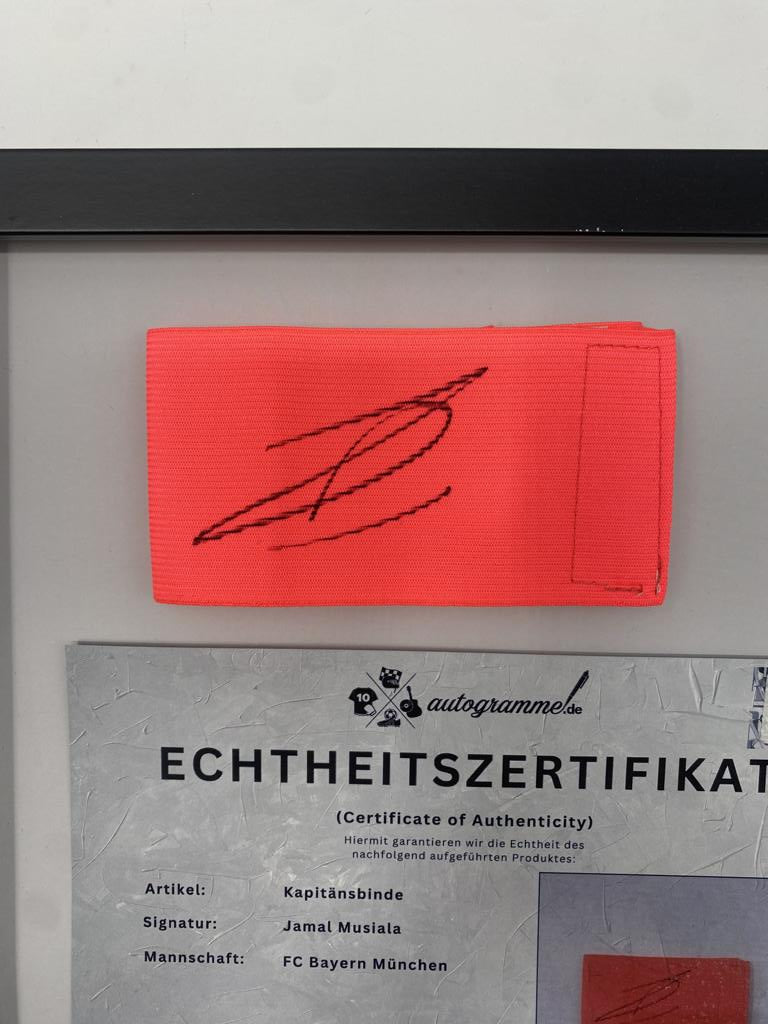 Captain's armband signed by Jamal Musiala in a Bayern Munich football autograph frame