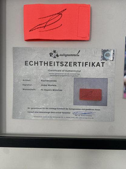 Captain's armband signed by Jamal Musiala in a Bayern Munich football autograph frame