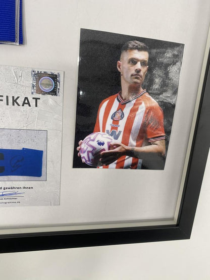 Captain's armband signed by Granit Xhaka in a frame, AFC Sunderland autograph