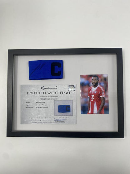 Captain's armband signed by Jonathan Tah in a Bayern Munich football autograph frame