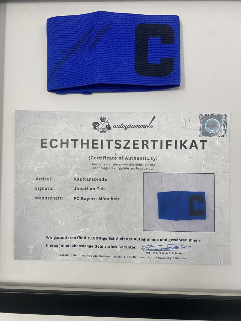 Captain's armband signed by Jonathan Tah in a Bayern Munich football autograph frame