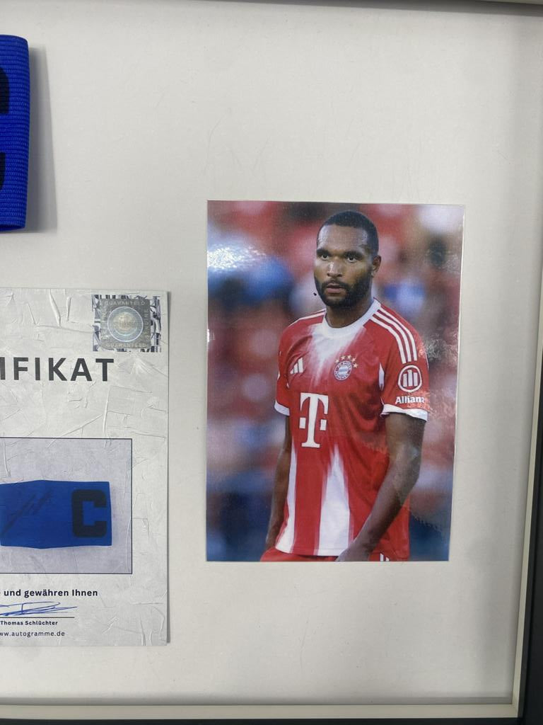 Captain's armband signed by Jonathan Tah in a Bayern Munich football autograph frame