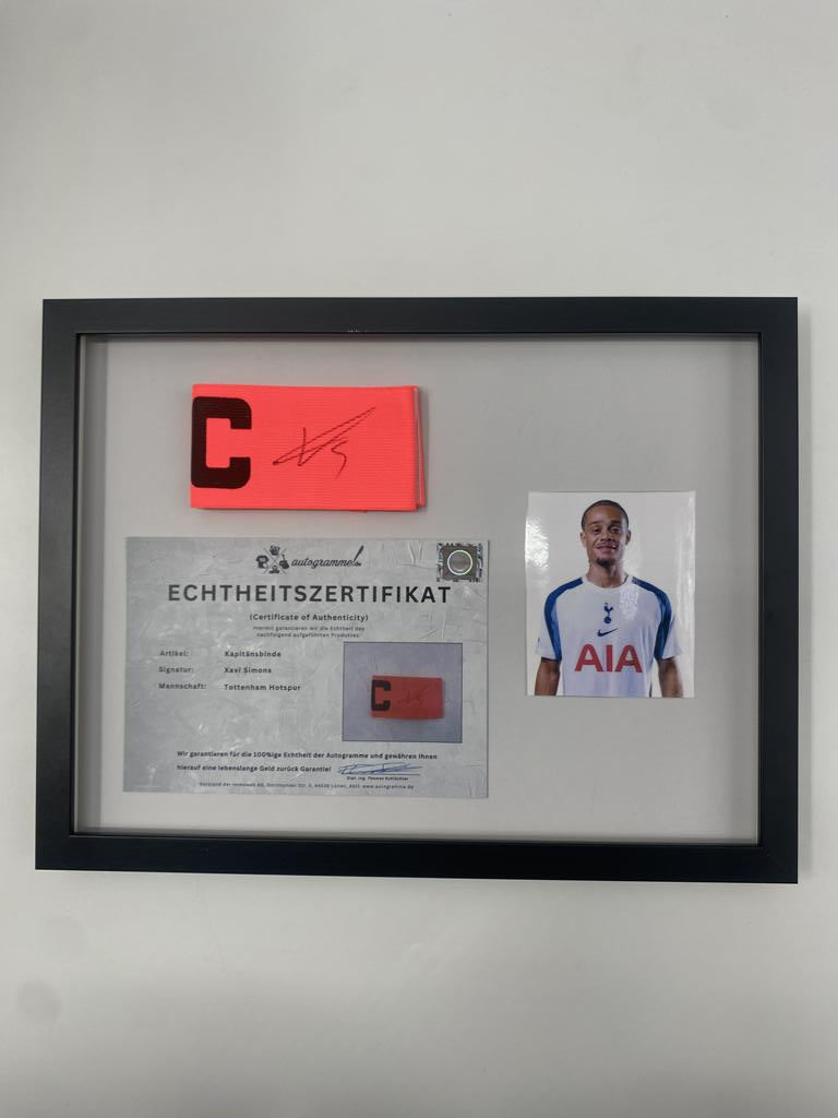 Captain's armband signed by Xavi Simons in a frame, Tottenham Hotspur