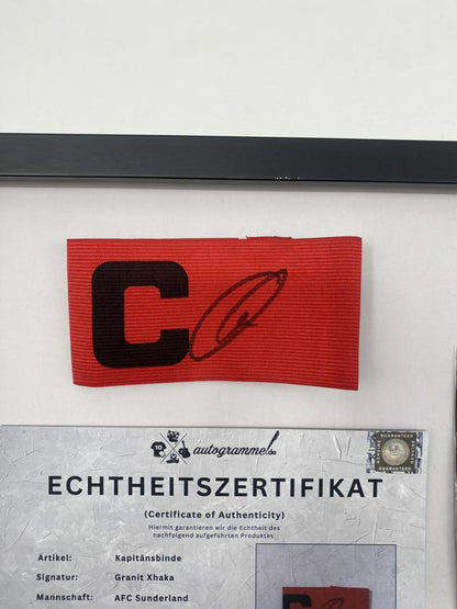 Captain's armband signed by Granit Xhaka in a frame, AFC Sunderland football autograph