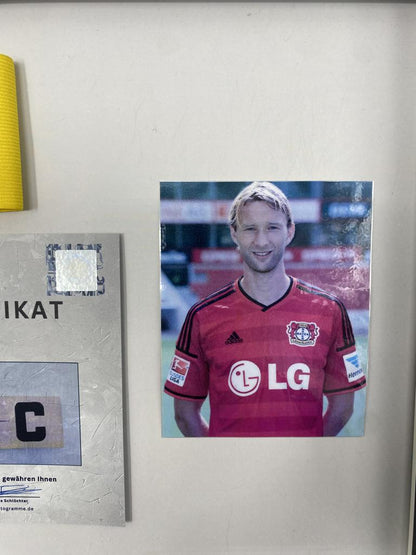 Captain's armband signed by Simon Rolfes in a frame, autographed by Bayer 04 Leverkusen