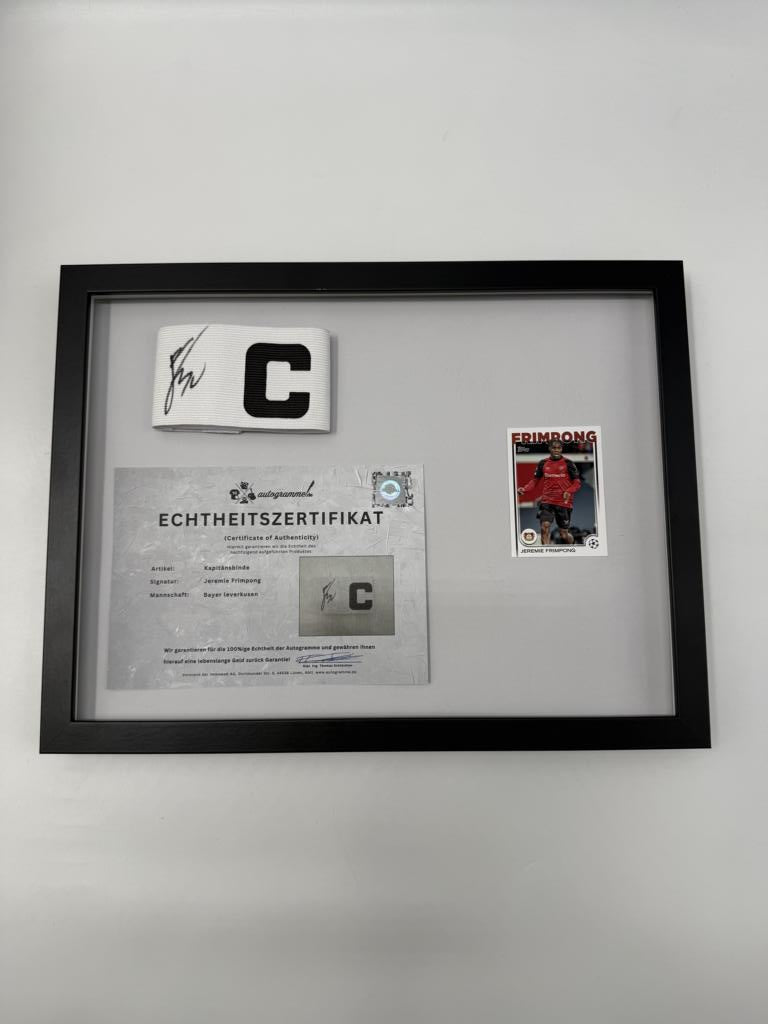 Captain's armband signed by Jeremie Frimpong in a frame, Bayer 04 Leverkusen autograph