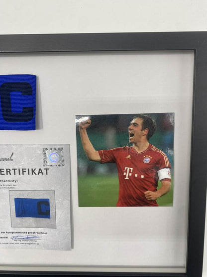 Captain's armband signed by Philipp Lahm in a Bayern Munich football autograph frame