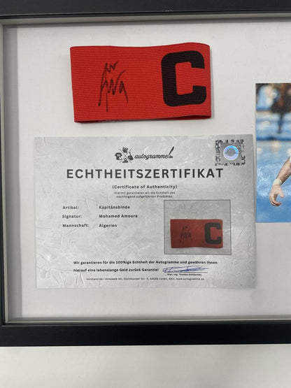 Captain's armband signed by Mohamed Amoura in a frame, Algeria Autograph COA