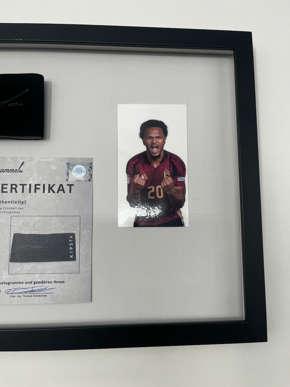 Captain's armband signed by Lois Openda in a frame Belgium Autograph COA
