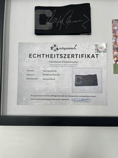 Captain's armband signed by Wolfgang Overath in a frame, Cologne Autograph