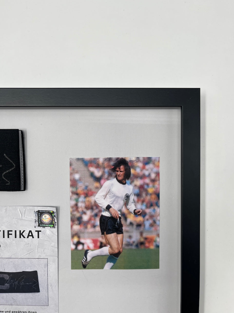 Captain's armband signed by Wolfgang Overath in a frame, Cologne Autograph