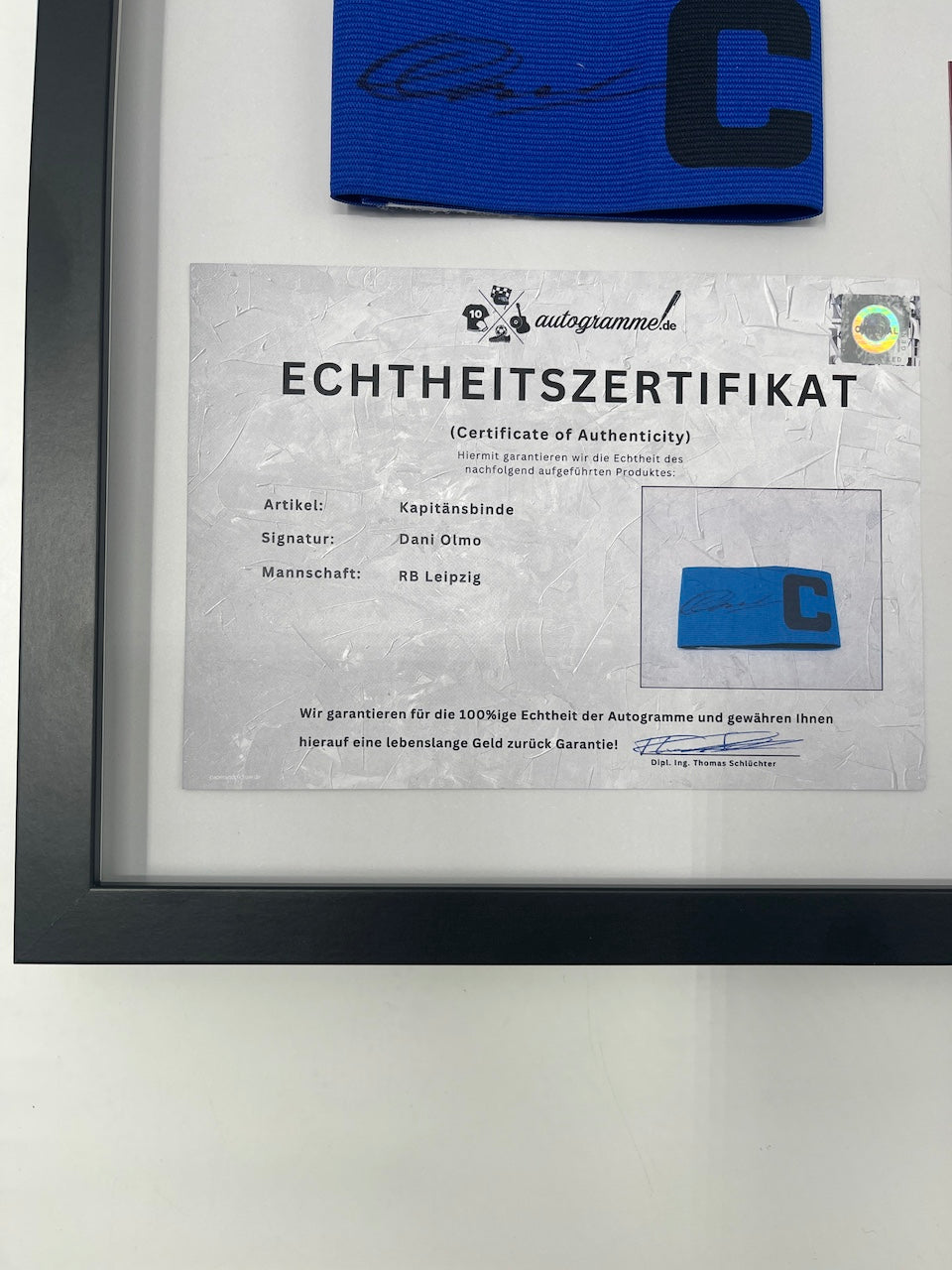 Captain's armband signed by Dani Olmo in a frame RB Leipzig autograph