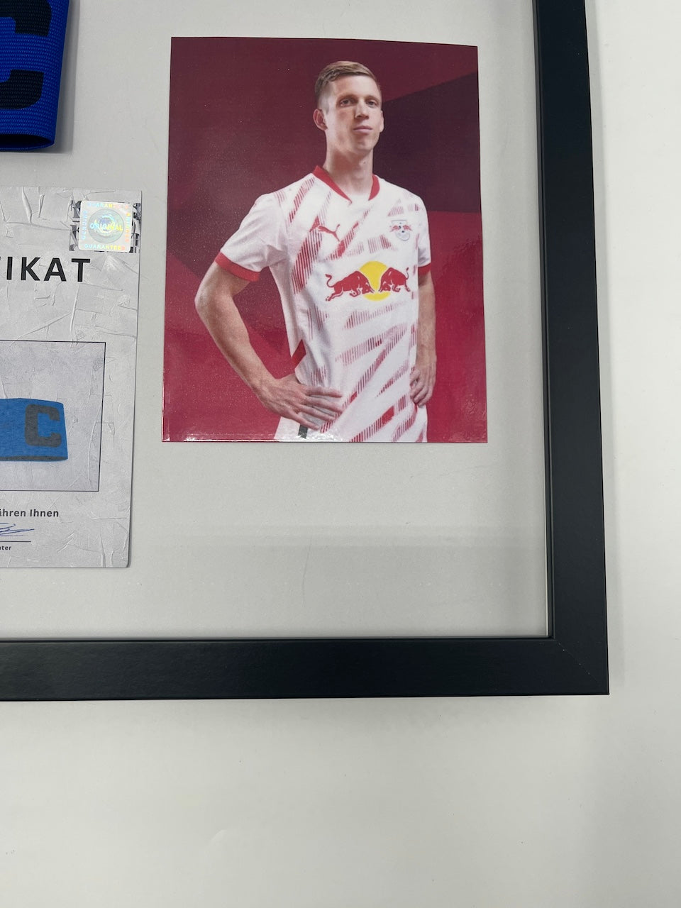 Captain's armband signed by Dani Olmo in a frame RB Leipzig autograph