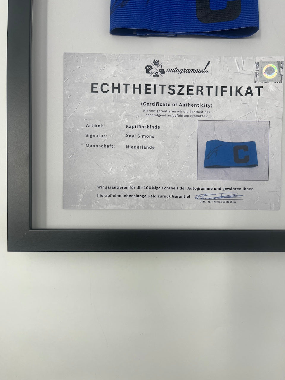 Captain's armband signed by Xavi Simons in a frame, Netherlands Autograph
