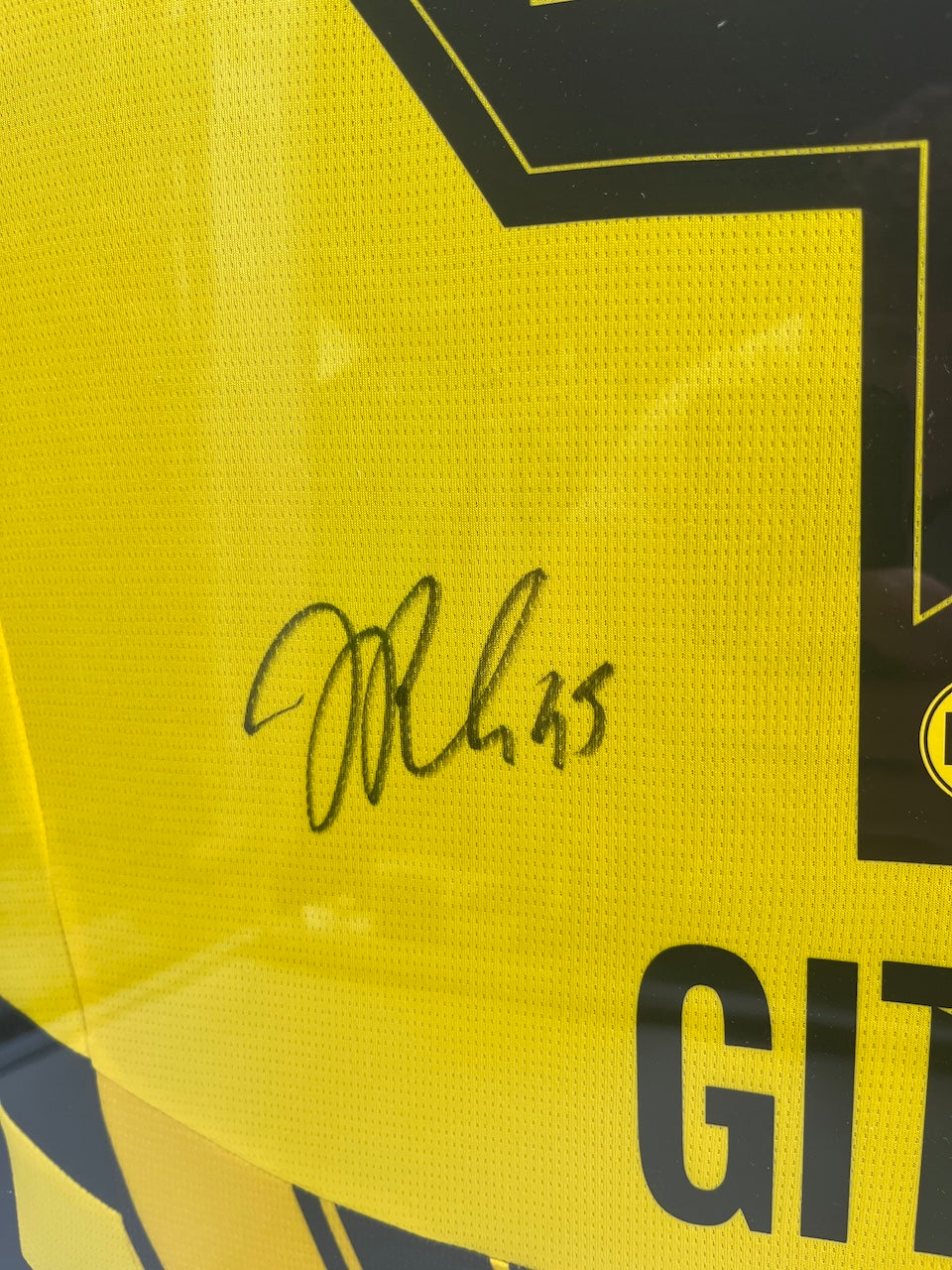 Borussia Dortmund jersey signed by Jamie Gittens in a Puma BVB frame