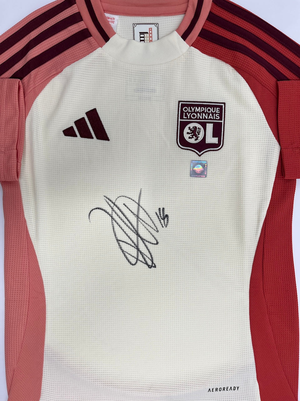 Olympique Lyon jersey signed by Rayan Cherki in an Adidas football frame, item number 128