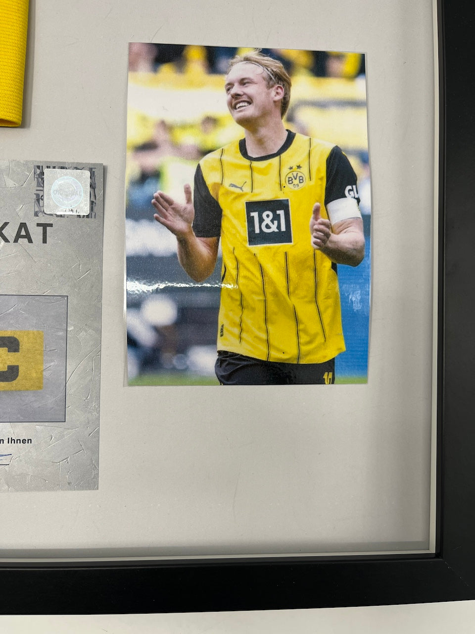 Captain's armband signed by Julian Brandt as part of the Borussia Dortmund COA