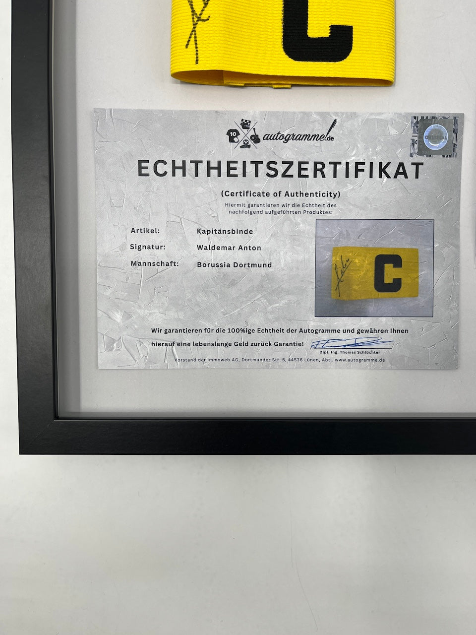 Captain's armband signed by Waldemar Anton in a Borussia Dortmund COA frame