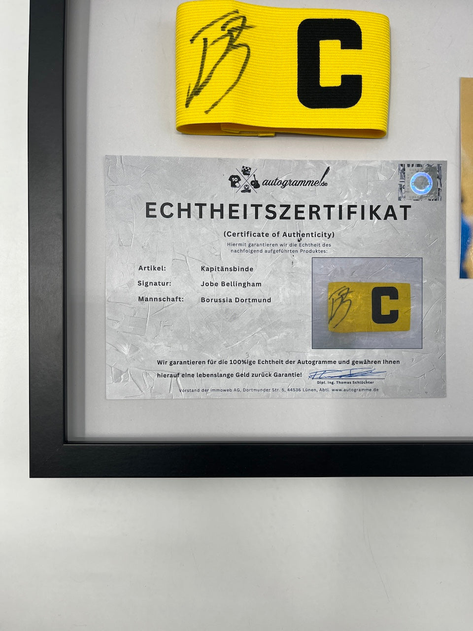 Captain's armband signed by Jobe Bellingham in a Borussia Dortmund COA frame