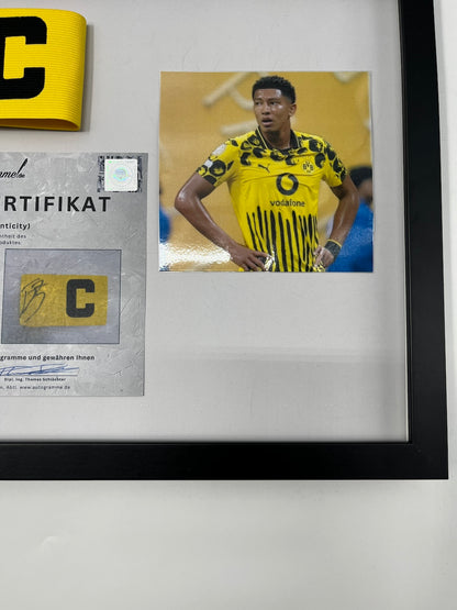 Captain's armband signed by Jobe Bellingham in a Borussia Dortmund COA frame