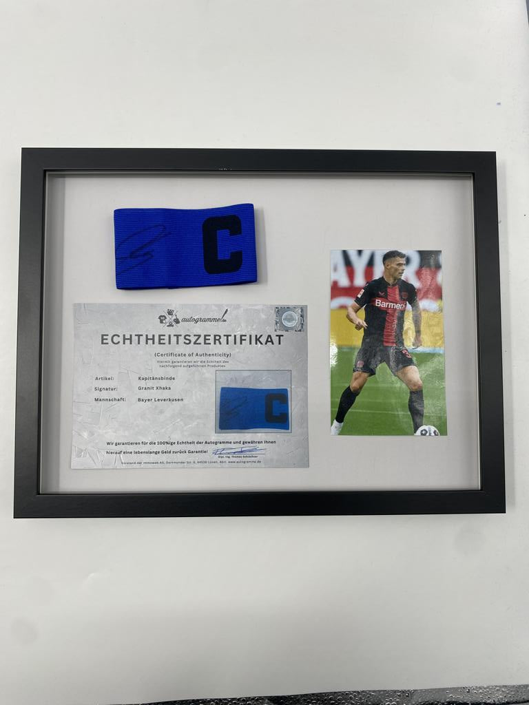 Captain's armband signed by Granit Xhaka in a frame, Bayer Leverkusen autograph