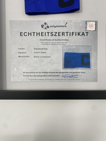 Captain's armband signed by Granit Xhaka in a frame, Bayer Leverkusen autograph