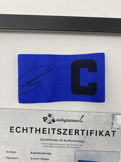 Captain's armband signed by Granit Xhaka in a frame, Bayer Leverkusen autograph