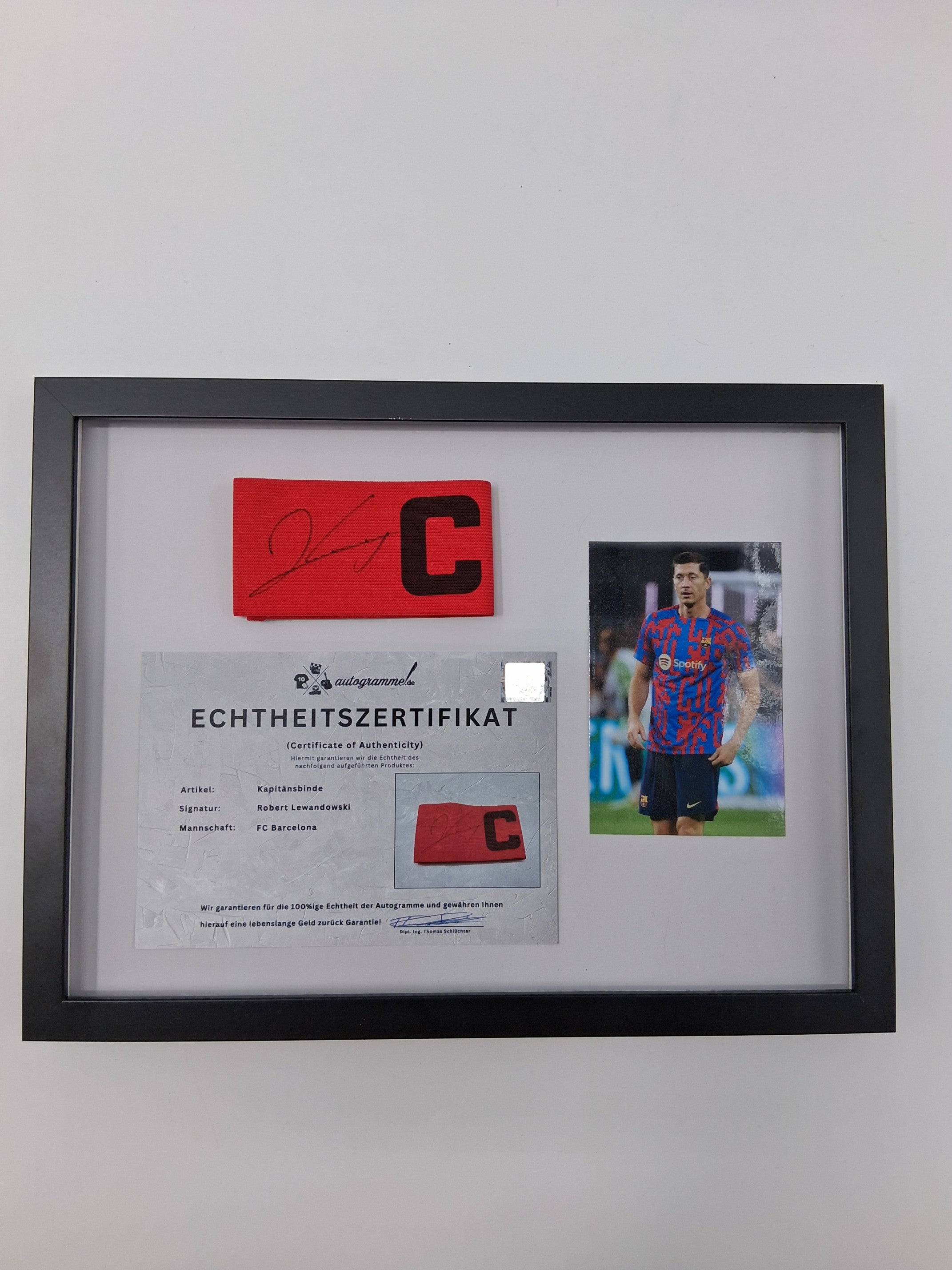 Captain's armband signed by Robert Lewandowski in a frame FC Barcelona football autograph