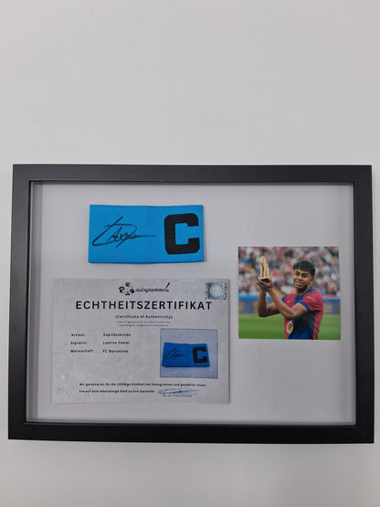Captain's armband signed by Lamine Yamal in a framed FC Barcelona COA autograph