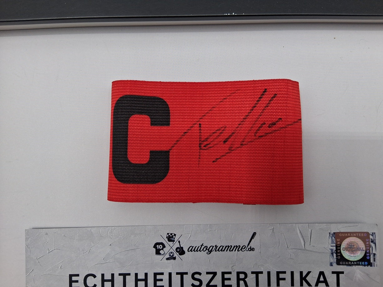 Captain's armband signed by Nathan Tella in a Bayer Leverkusen autograph frame