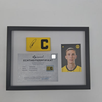 Captain's armband signed by Nico Schlotterbeck in a Germany COA frame