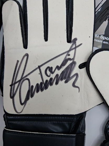 Goalkeeper glove signed by Toni Schumacher in a frame, autographed football
