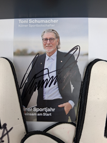 Goalkeeper glove signed by Toni Schumacher in a frame, autographed football