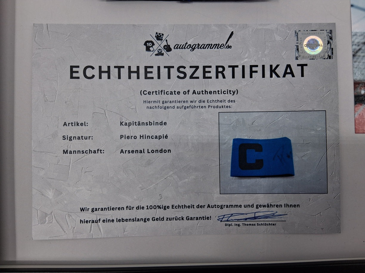 Captain's armband signed by Piero Hincapié in a frame, autographed by Bayer 04 Leverkusen