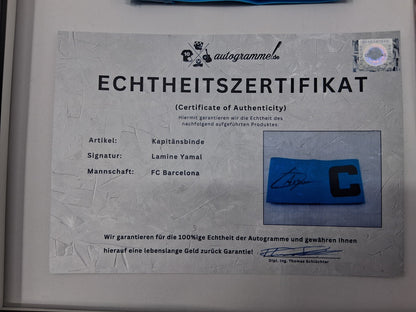 Captain's armband signed by Lamine Yamal in a framed FC Barcelona COA autograph